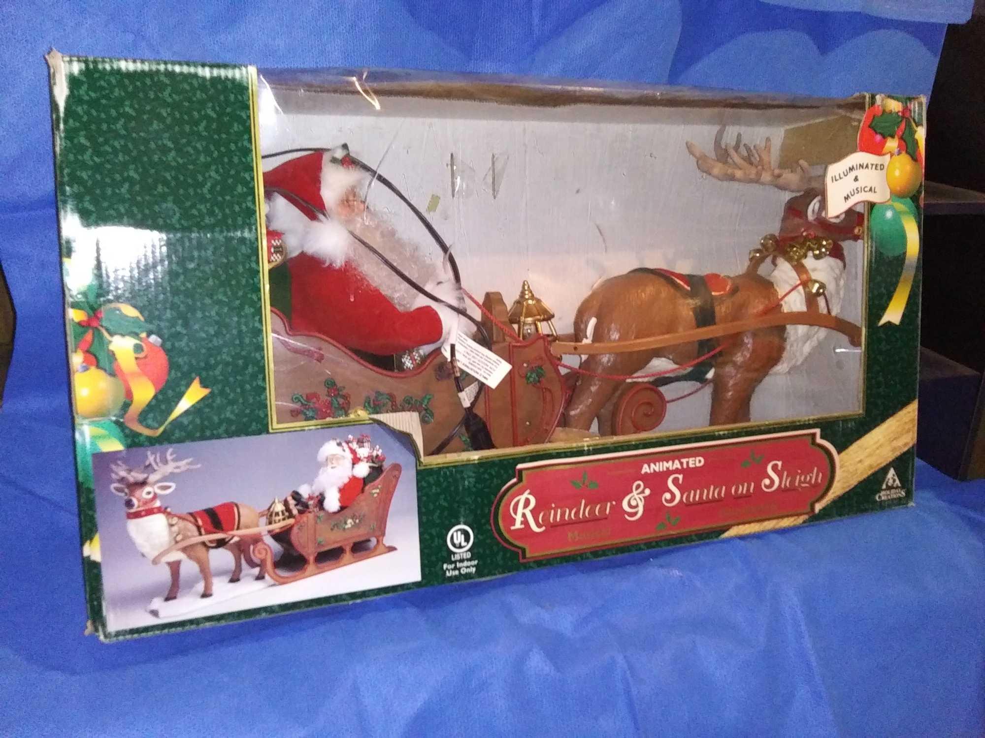 large animated Reindeer and Santa on sleigh, illuminated, animated, and Musical!
