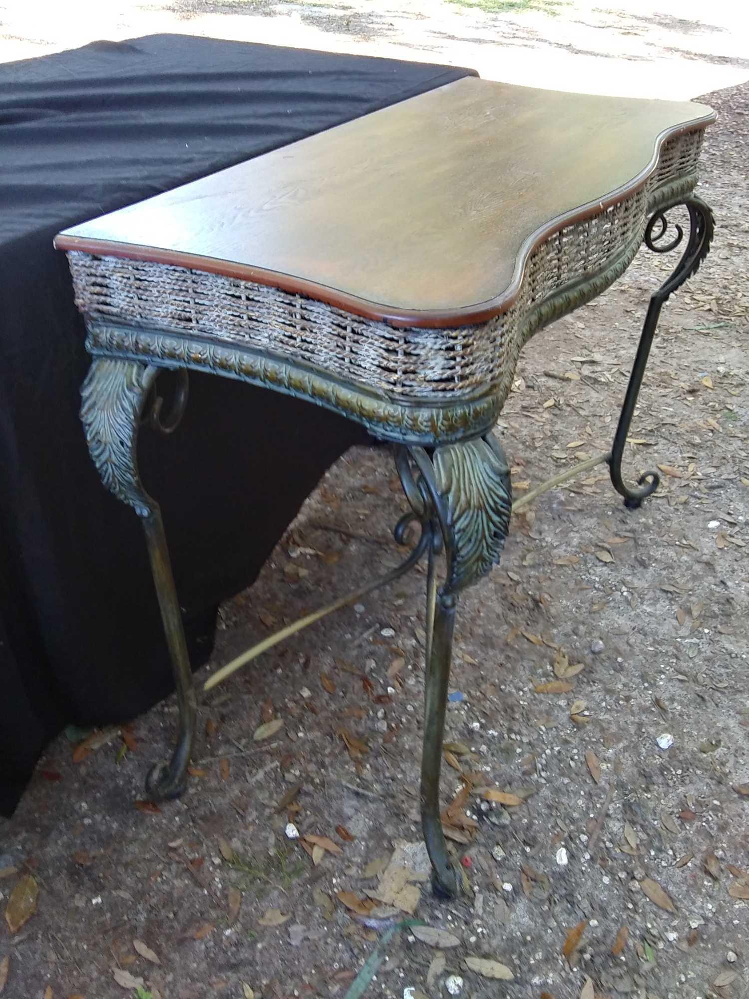 metal and braided rope entryway table with pineapple finial accent