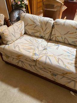 Cool Oriental styled upholstered Trendline loveseat with wood frame rolled arms