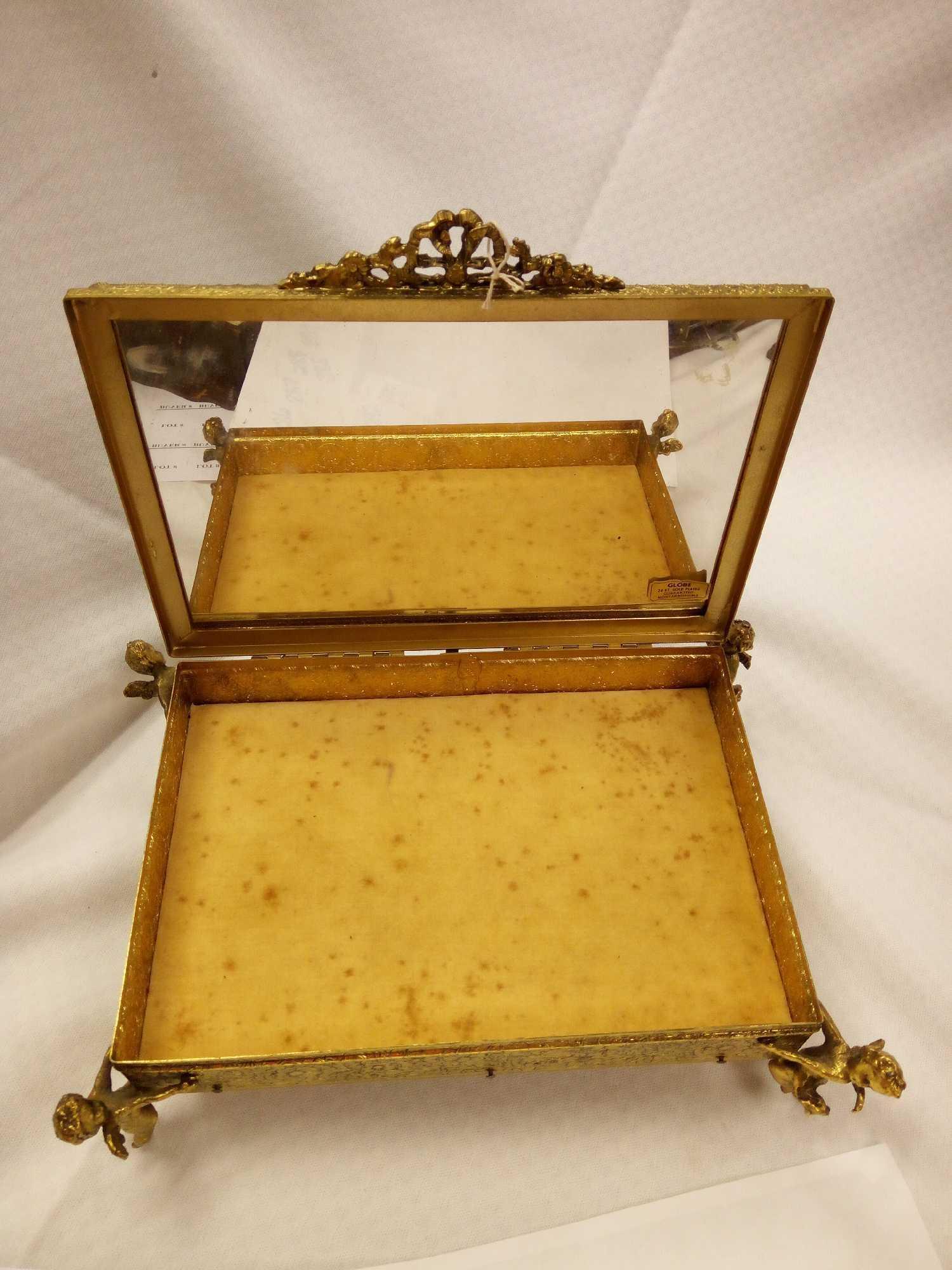 ANTIQUE GOLDEN METAL MIRRORED JEWELRY BOX WITH FLANKING CHERUBS