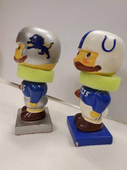 PAIR OF VINTAGE SPORTS JAPAN BOBBLEHEADS: COLTS and LIONS