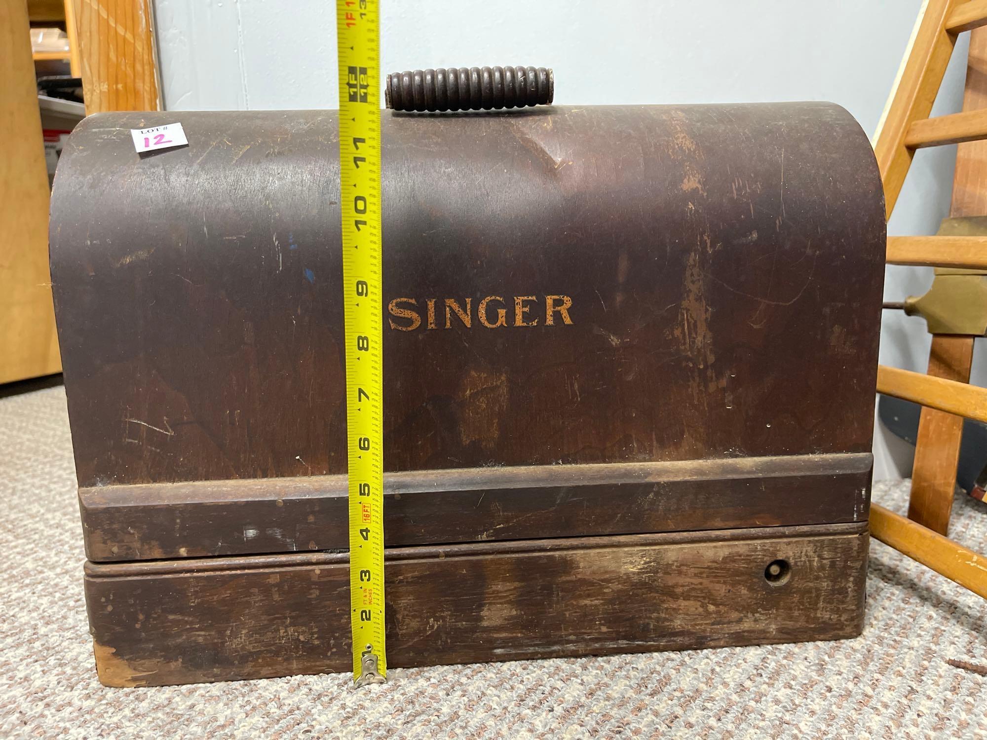 VINTAGE SINGER PORTABLE SEWING MACHINE. UNOPENED, NO KEY HEAVY. UNKNOWN MODEL INSIDE