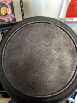 PAIR OF CAST IRON INCLUDING EMERIL AND 4D SIZE 3