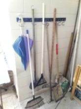 GARDENING GROUPING, RAKES AND SHOVELS PLUS REALLY TALL REBAR AND GROUT