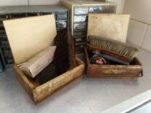 A PAIR OF VERY COOL OLD WOODEN BOXES WITH METAL LIP LATCHES, SHOE POLISH CONTENTS AND MORE