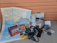 Vintage desk items including Rand McNally maps, garmin nuvi , bell south walkie talkies, more