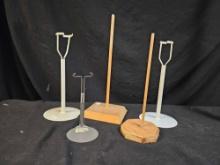 Grouping of collectible doll stands -, metal and wooden.