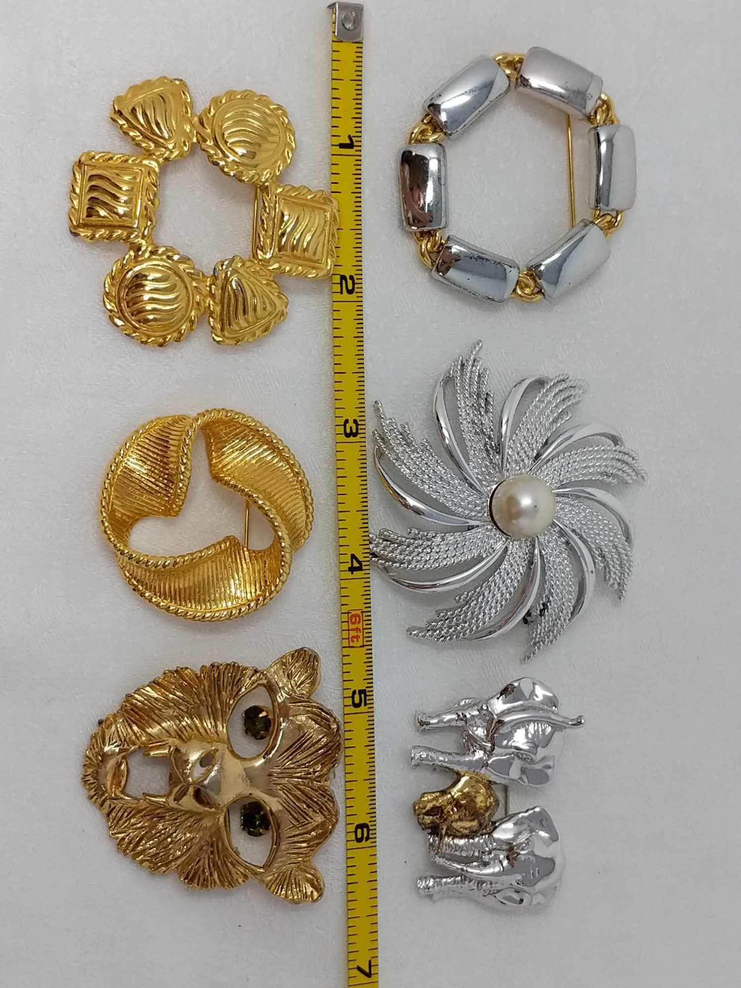 6 Costume Brooches