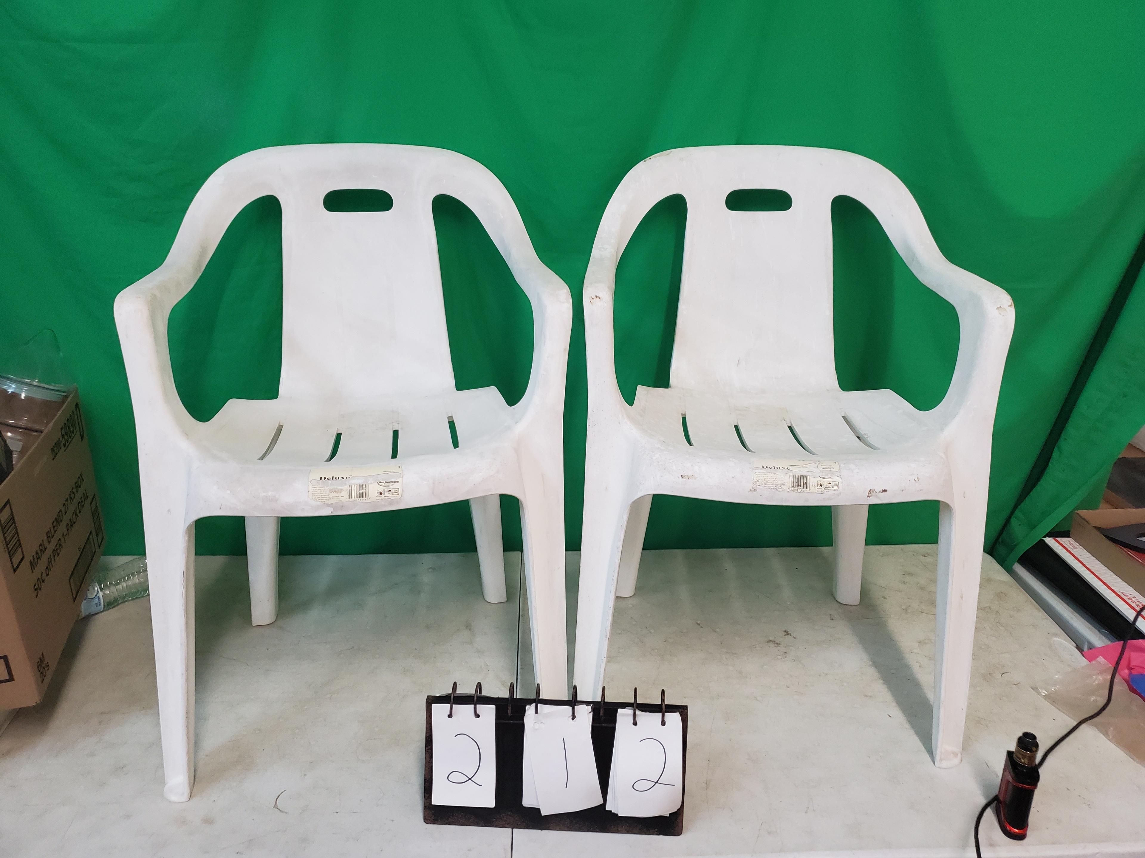 2 white patio chairs