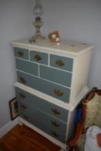 white and Blue Vintage Dresser with Gas Lamp and Arizona Memorabilia on top