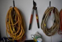 Hose, Group of Extension Cords, and Loppers