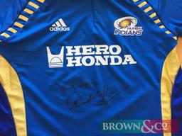 Mumbai Indians cricket team shirt from the 2011 IPL season signed by Sachin Tendulkar. Kindly