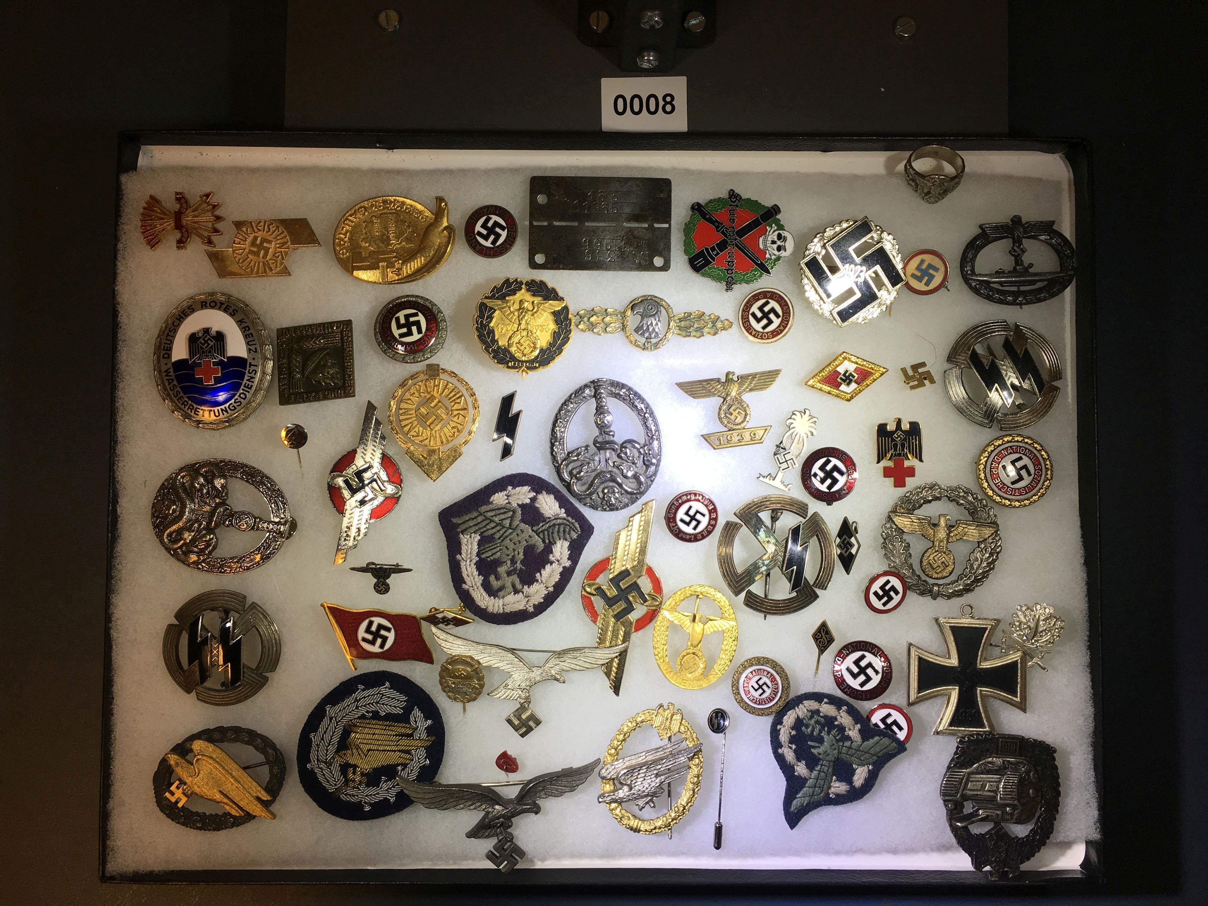 Collection of Nazi pins and badges. All items in lot photos are included.