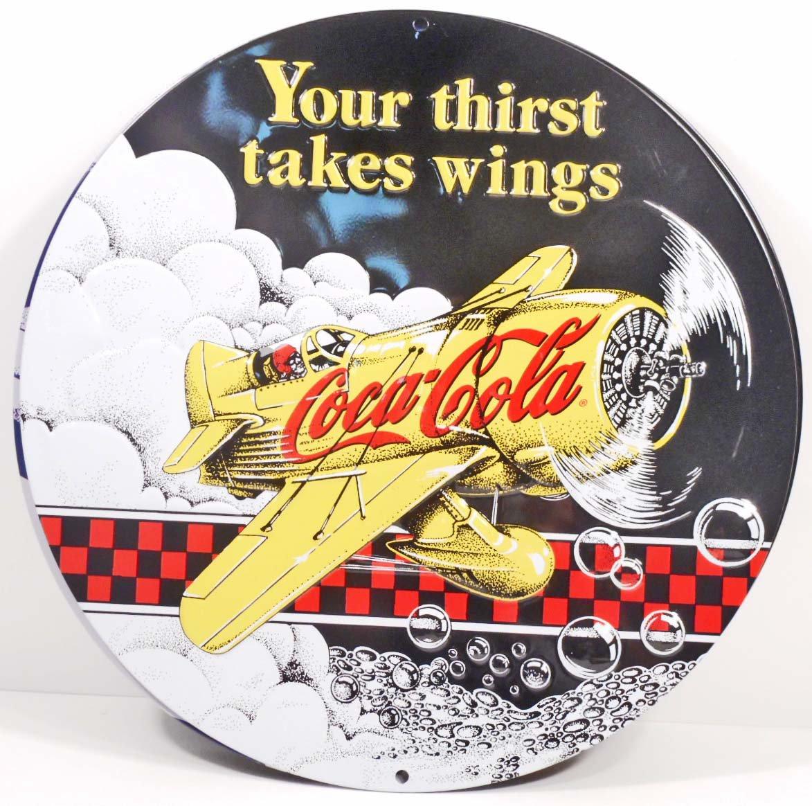 COCA COLA THIRST TAKES WINGS ROUND EMBOSSED METAL TIN SIGN