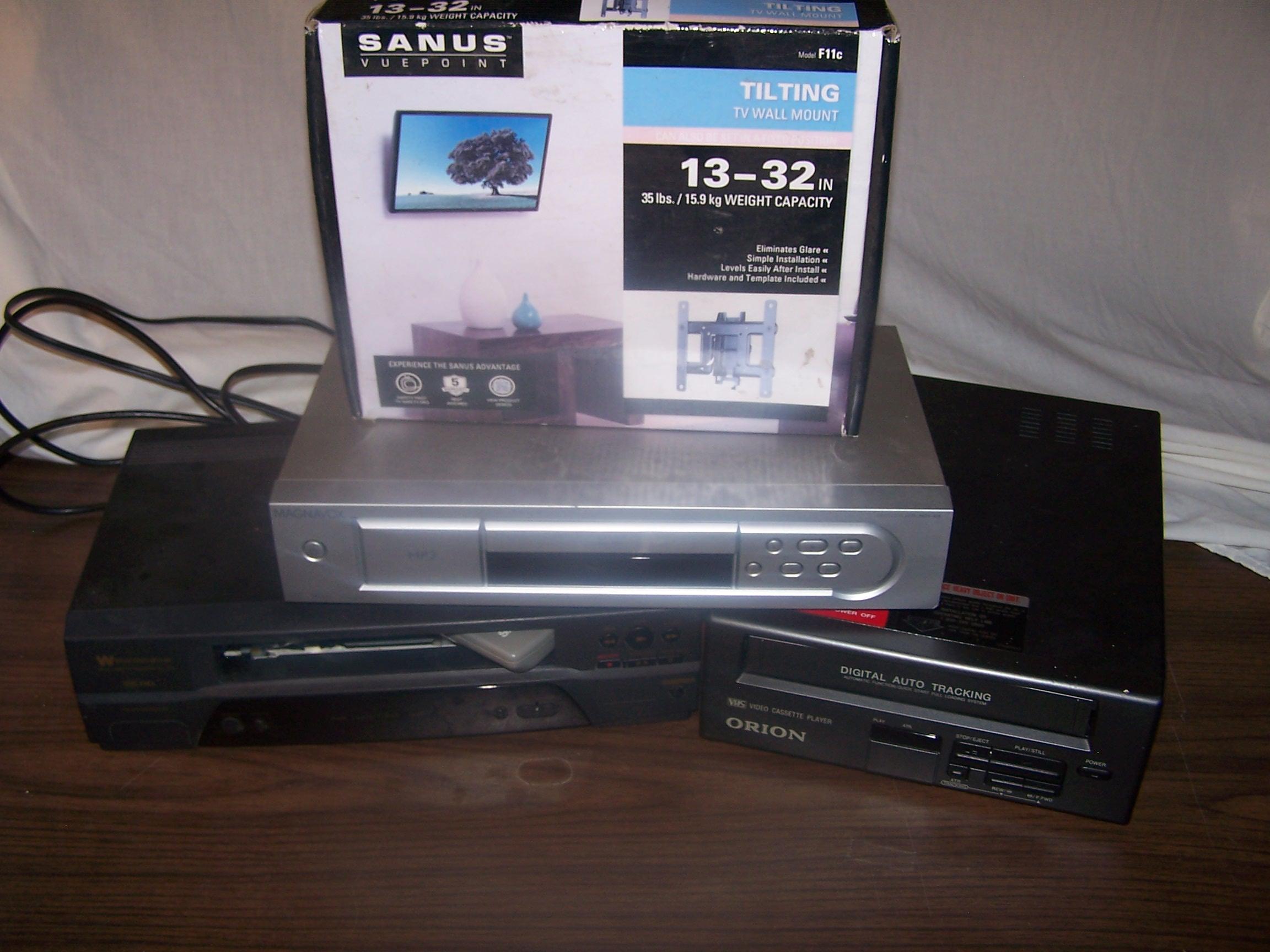 2 Vcr's, 1 Dvd player and 1 wall mount