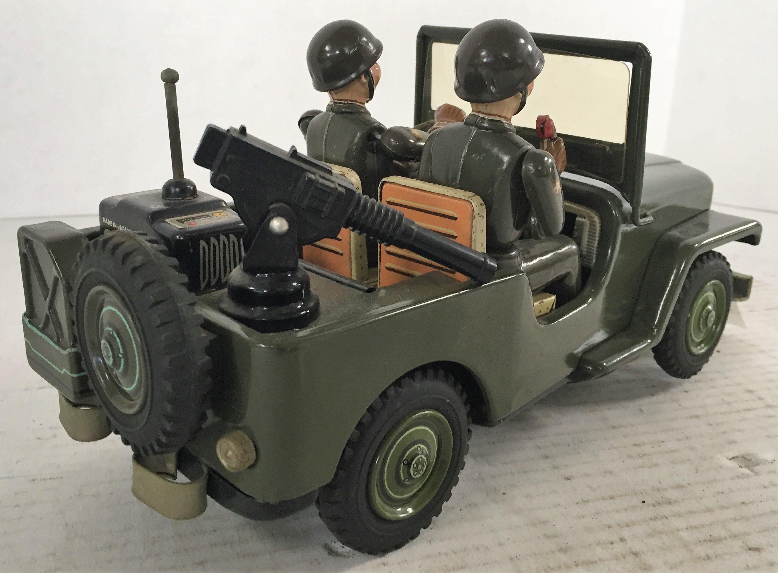 1950'S NOMURA TIN. BATTERY OPERATED ARMY JEEP W/DRIVER AND PASSENGER