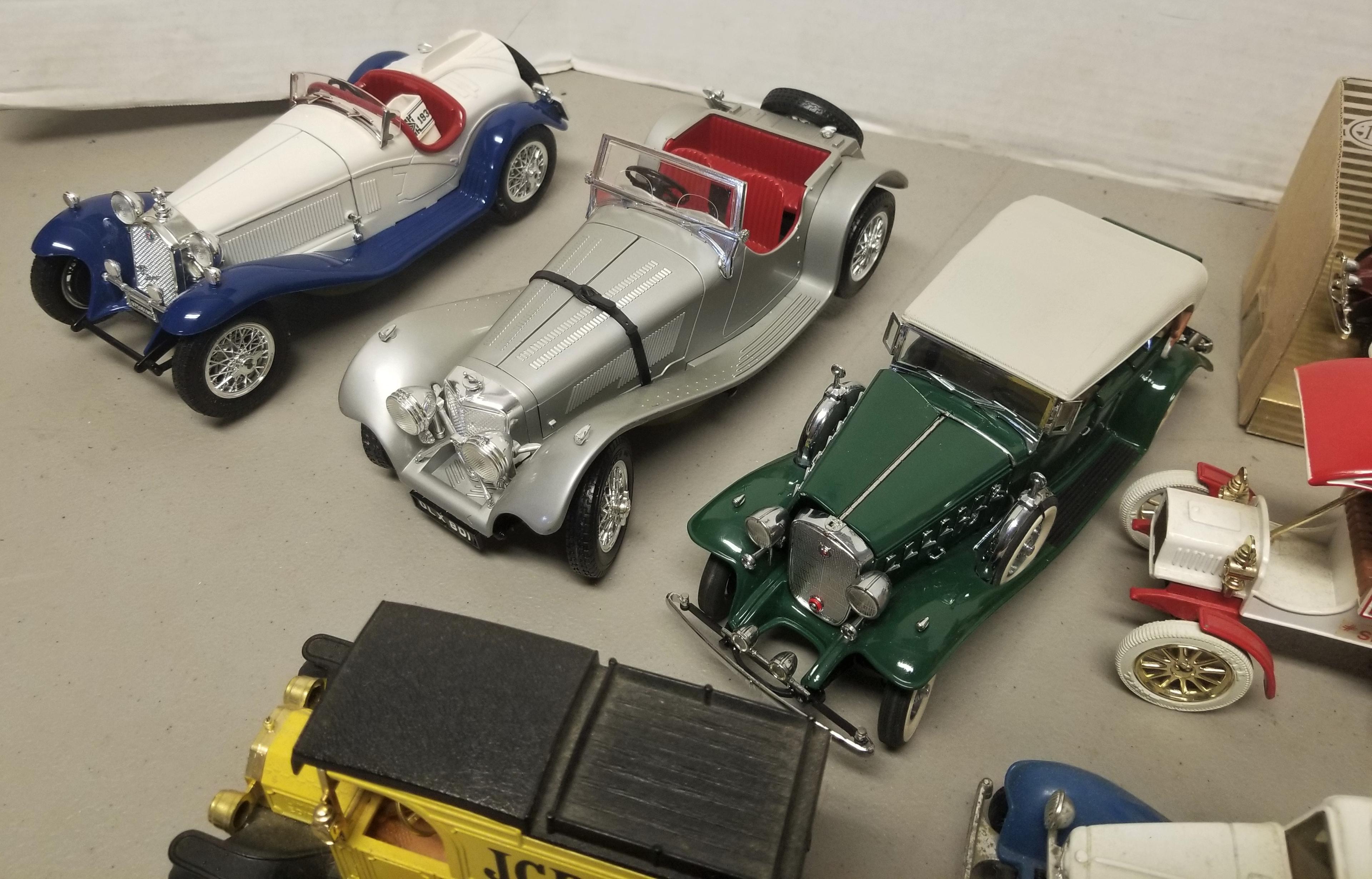 8 assorted model cars,