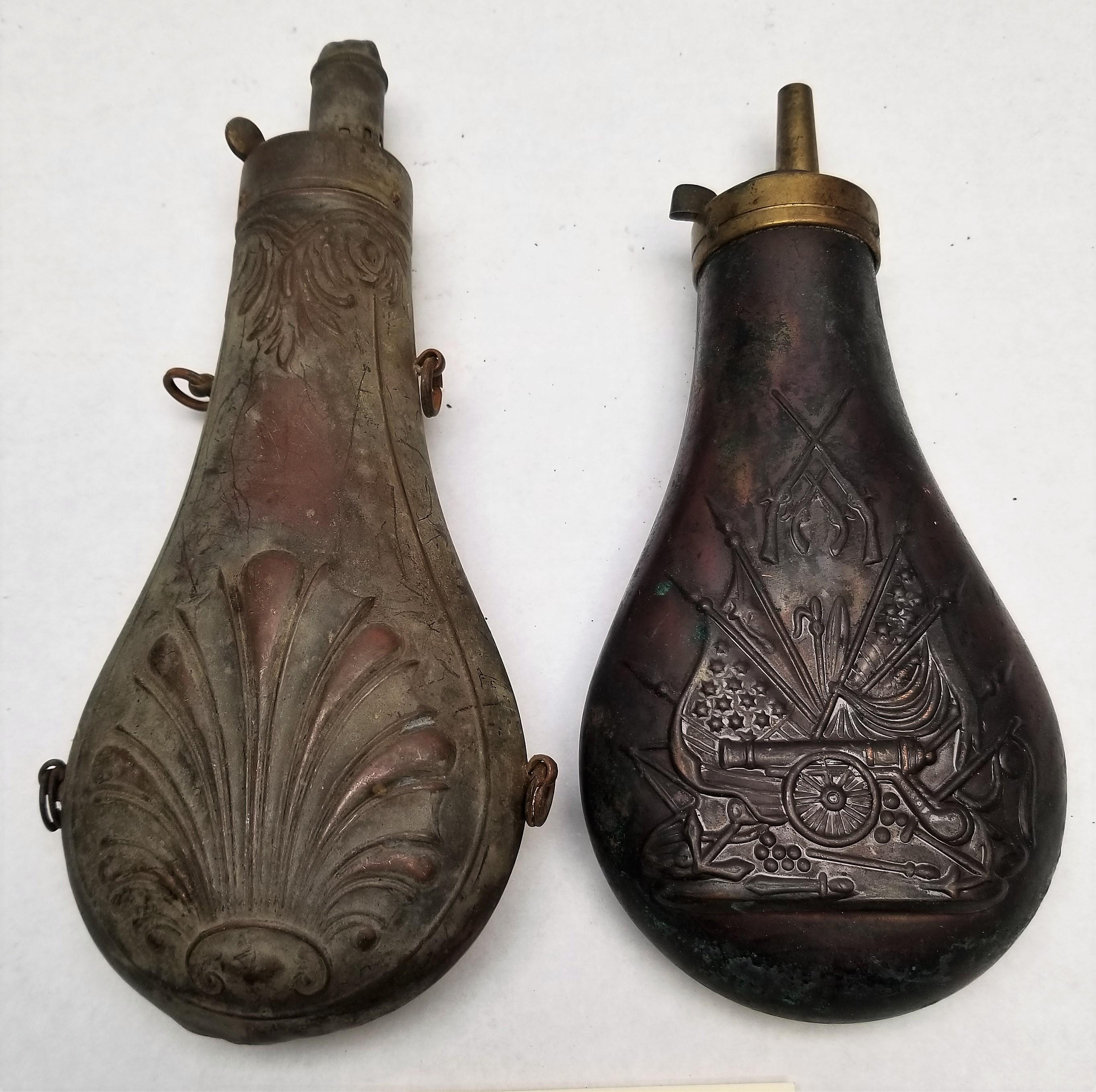 (2) Early Brass Embossed Powder Flasks