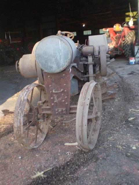 1020 Titan, complete, unrestored. Not running, engine is loose. Lugs for RR are there but not on rim