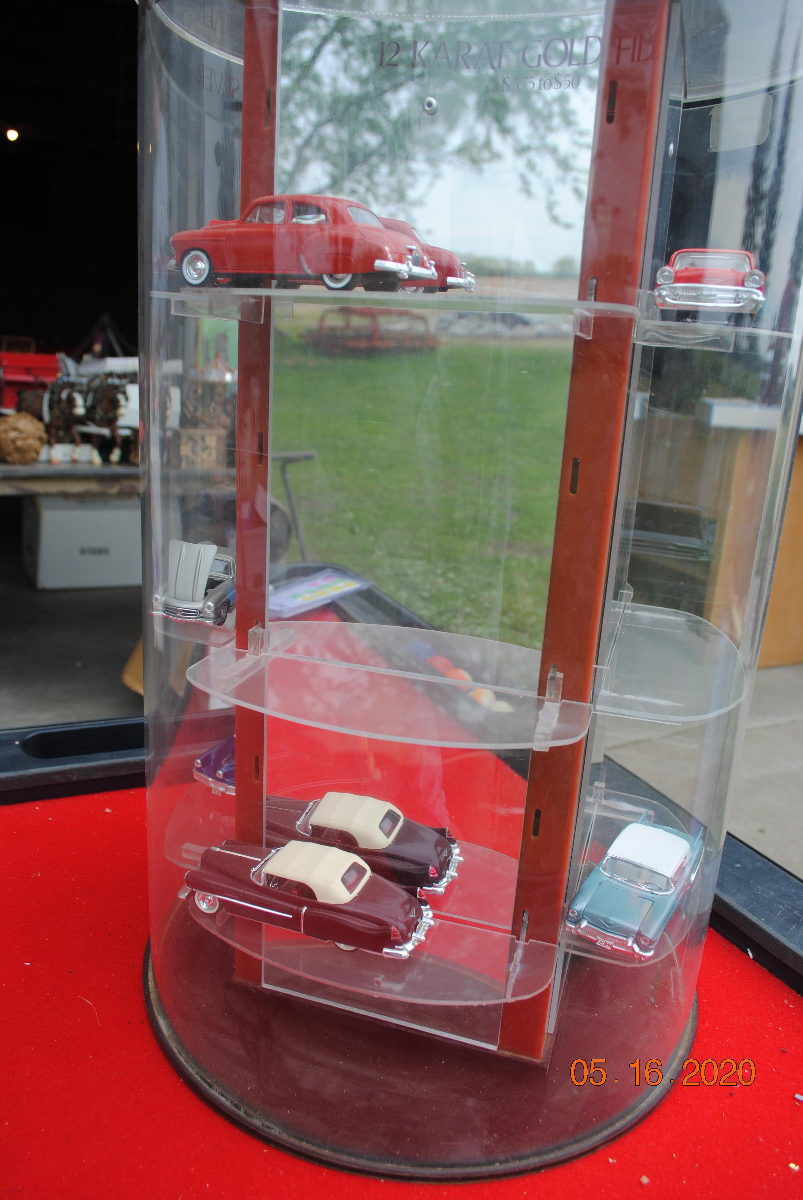 Display case with vintage cars