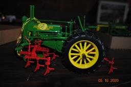 Precision John Deere 2-cylinder tractor with mounted row cultivator