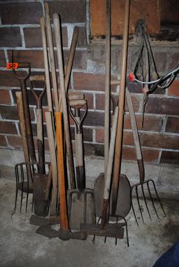 Handled tools including shovels, forks, spade, scythe