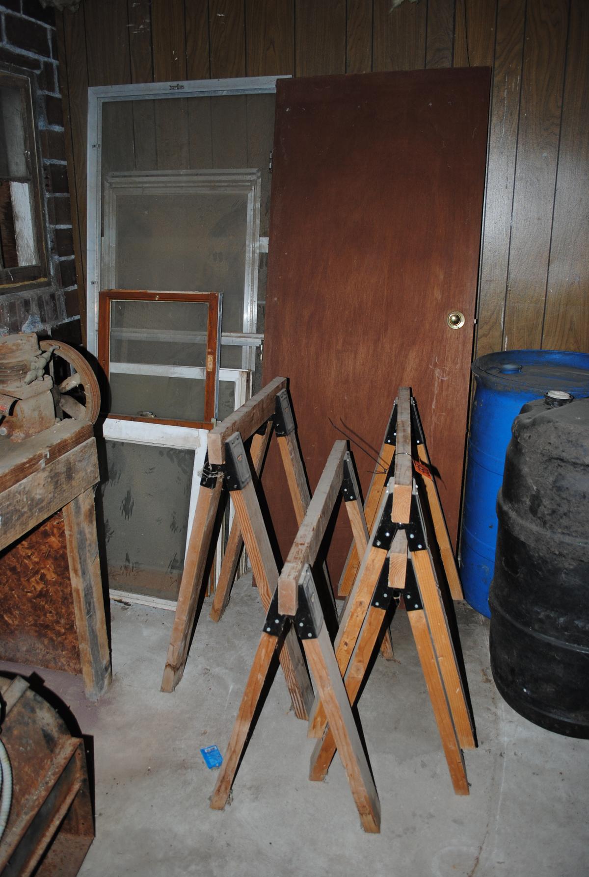 Wooden saw horses, wood door, misc. windows