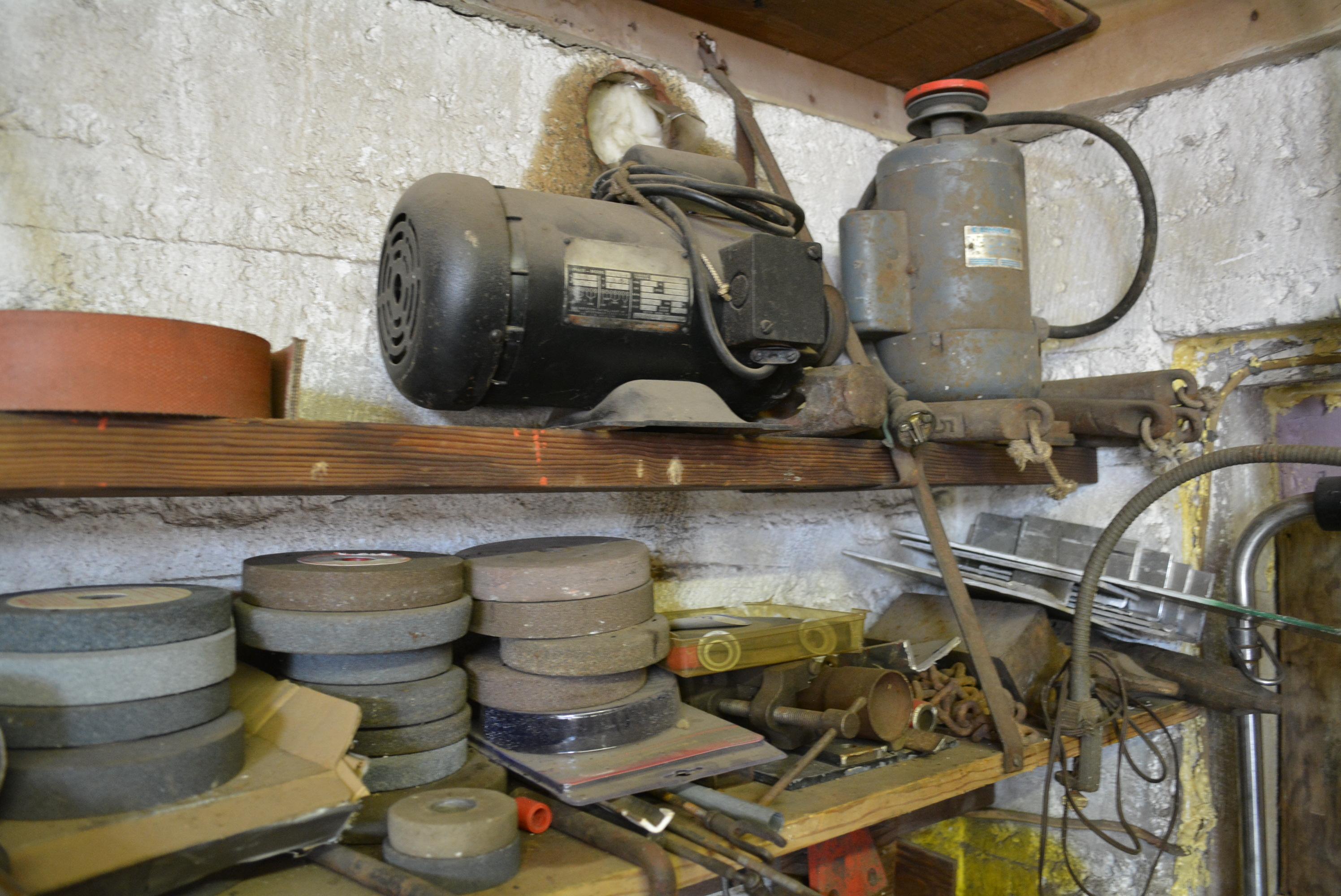 Assorted scrap iron and metal pieces. This lot located on west wall of shop