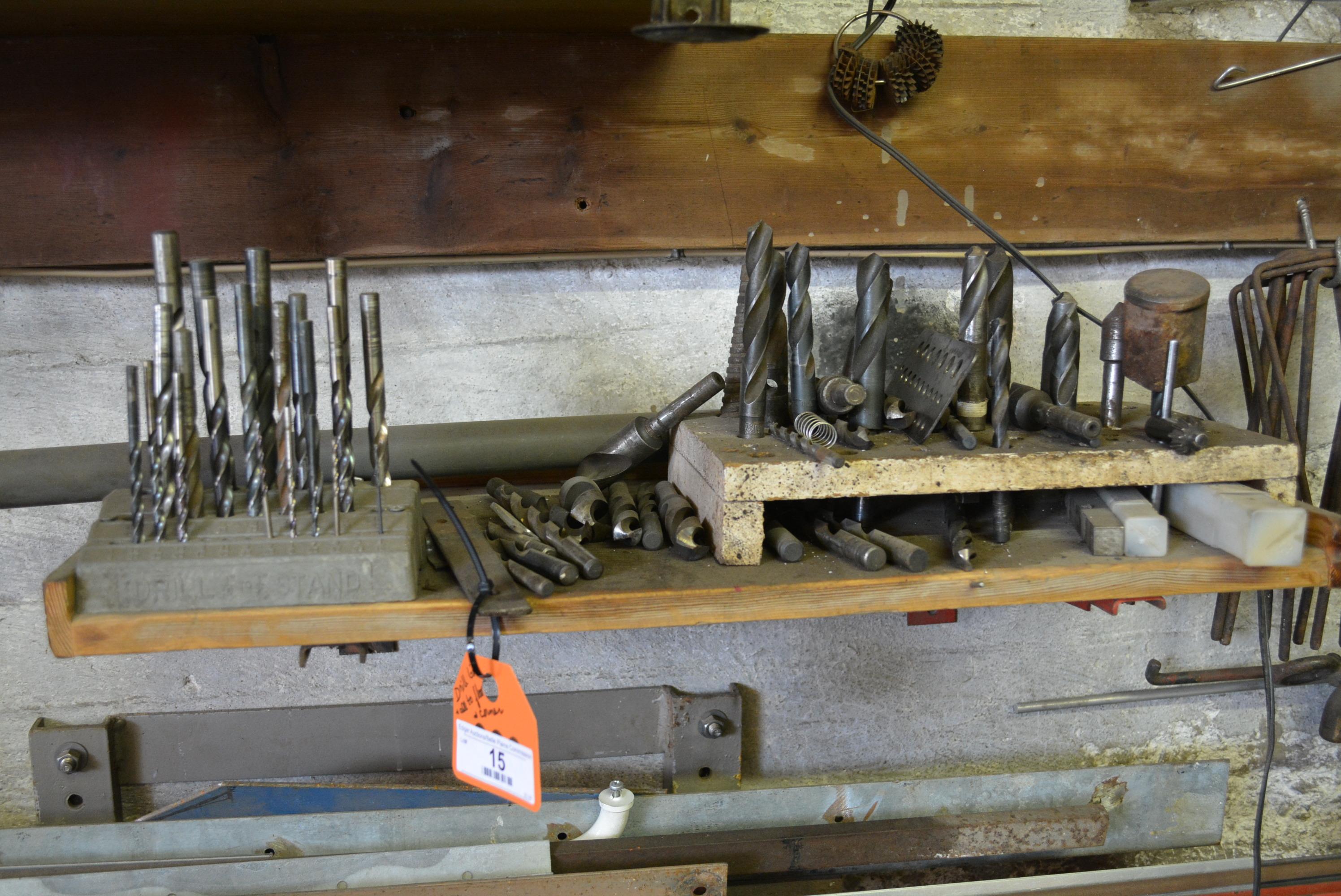 Assorted drill bits and large assortment of scrap iron and metal pieces. This lot is bottom part of