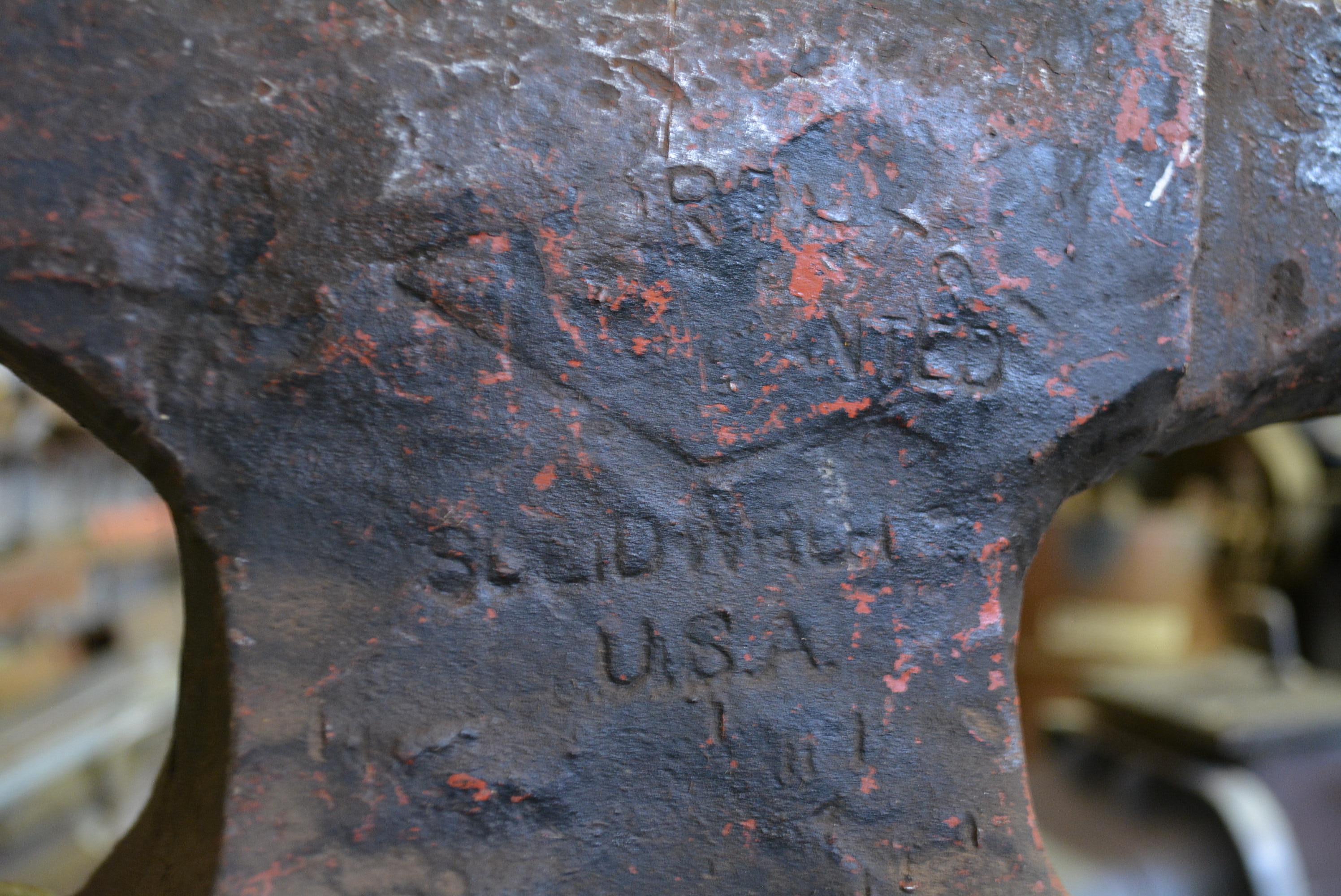 Anvil, 21"x3"; attached to stump stand. Anvil is stamped, stamp is illegible