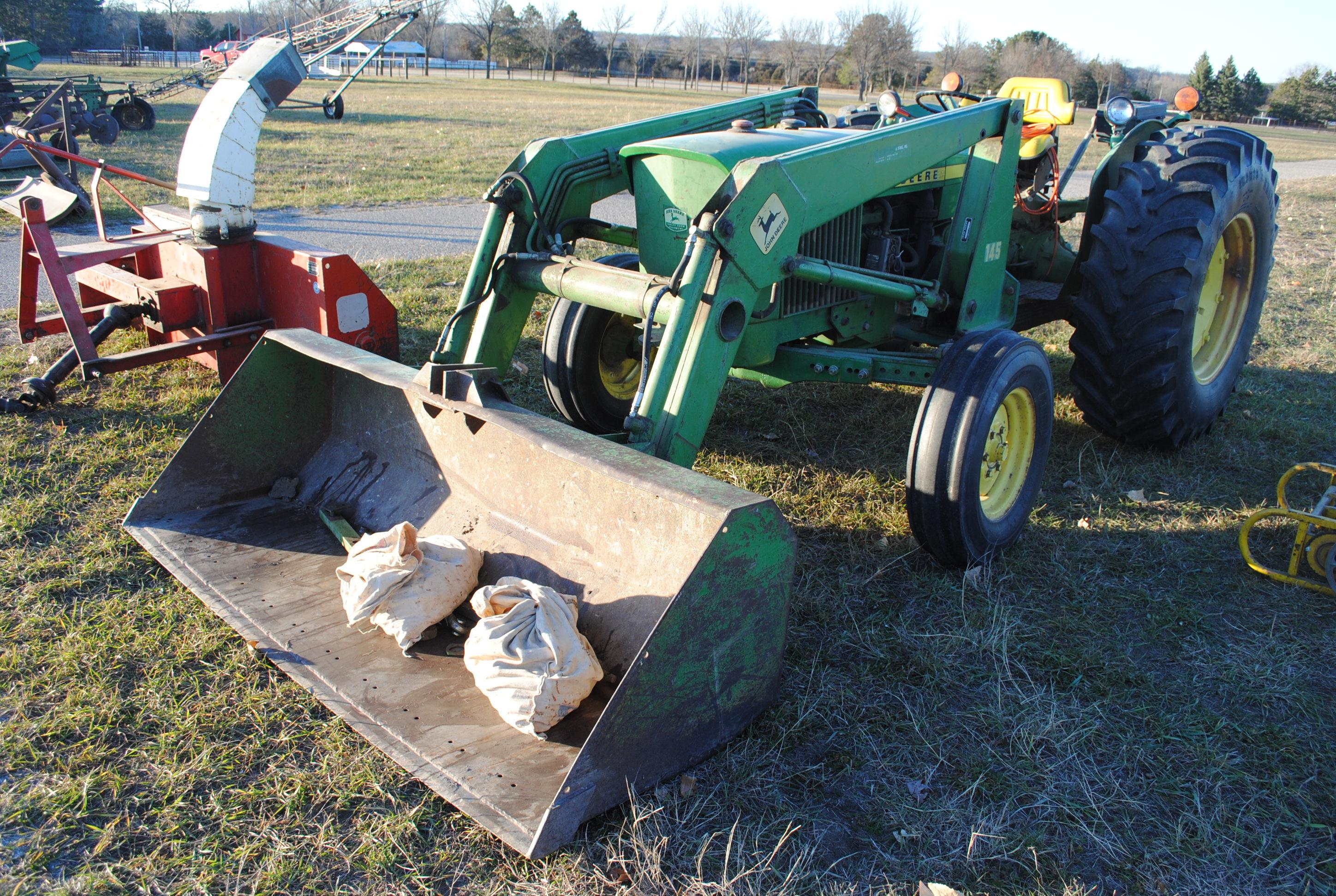 John Deere 1530 diesel tractor with John Deere 145 loader that has 7' bucket, wide front, 2 hydrauli