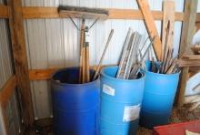 3 Plastic barrels with handled tools, misc. aluminum & iron, wood handles