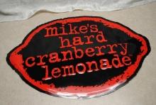 "Mike's Hard Cranberry Lemonade" stamped tin sign, measures approx. 28.5" by 19", slight kinks on si