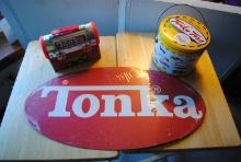 3 Pieces including: "Tonka 2-sided oval sign" (plastic or cardboard), "Tonka Lunchbox" and "Tonka To