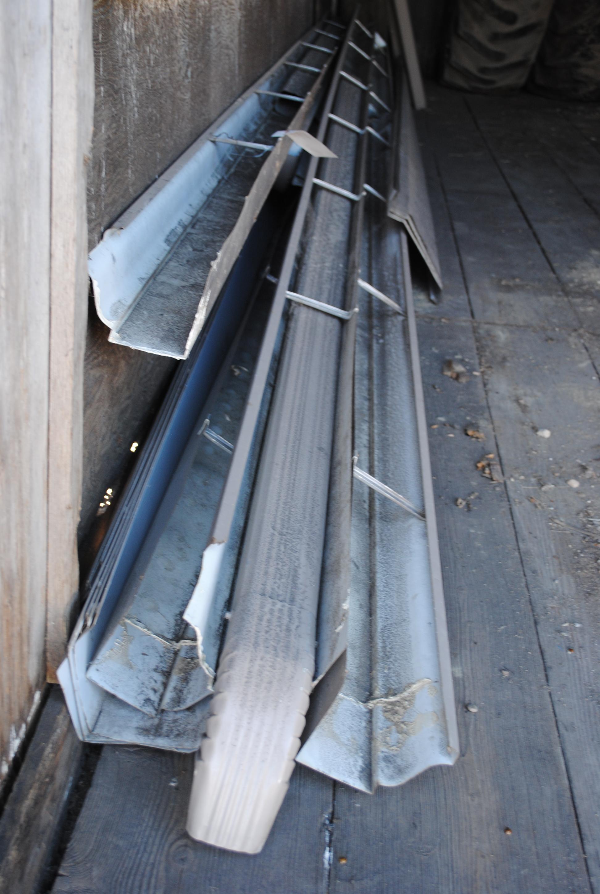 Misc. Gutters, Downspouts & Corner Flashing, stored inside livestock trailer (sells as one lot)