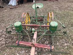 2 row horse drawn John Deere planter with wire check and cast iron John Deere container lids with