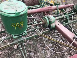 2 row horse drawn John Deere planter with wire check and cast iron John Deere container lids with