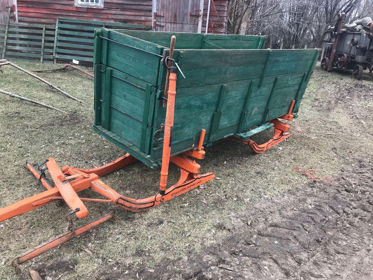 John Deere horse drawn wooden wagon. 3' x 10.5' on sled runners (Stoughton curved knee). Box has