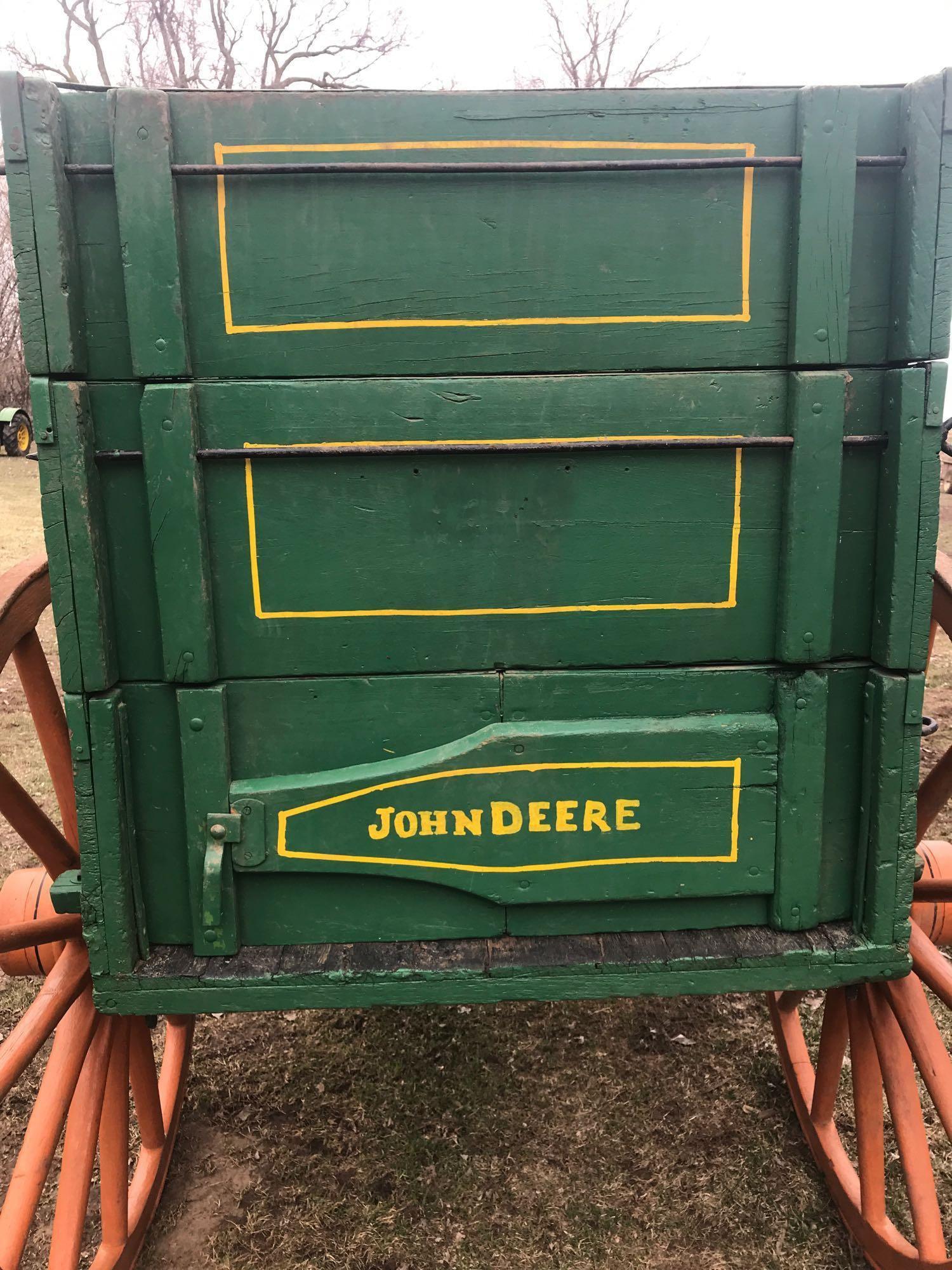 John Deere horse drawn wooden wagon. 3' x 10.5'. Wood spoke wheels (rears are 54", front are 44") In