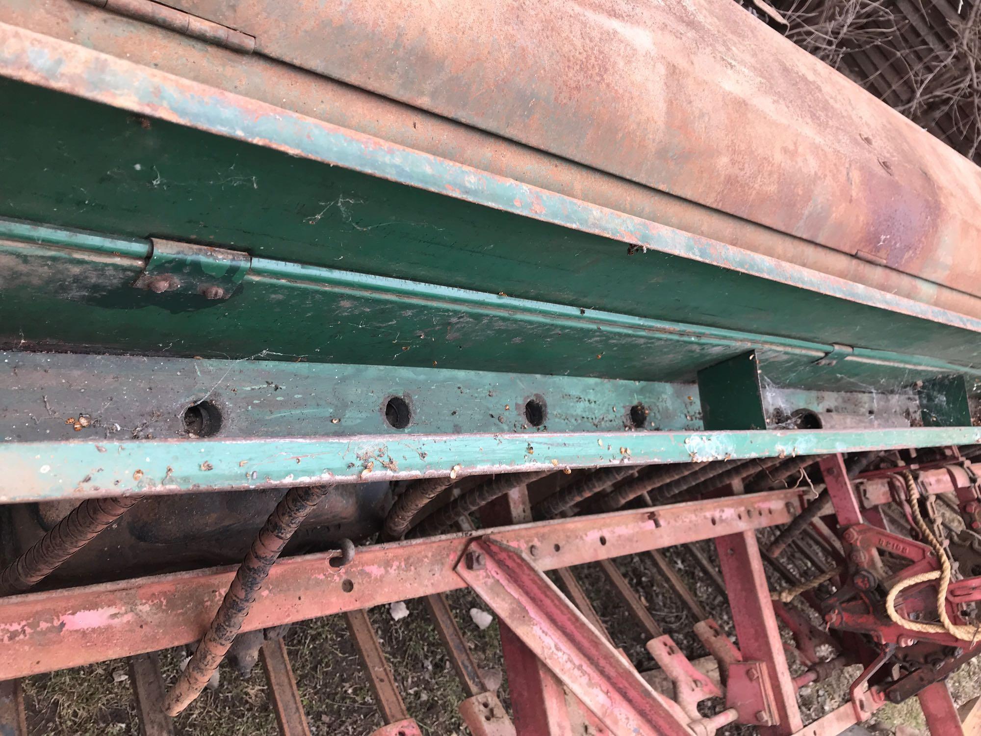 Oliver 12' grain drill with grass attachment, 6" spacing on steel wheels. Excellent condition.