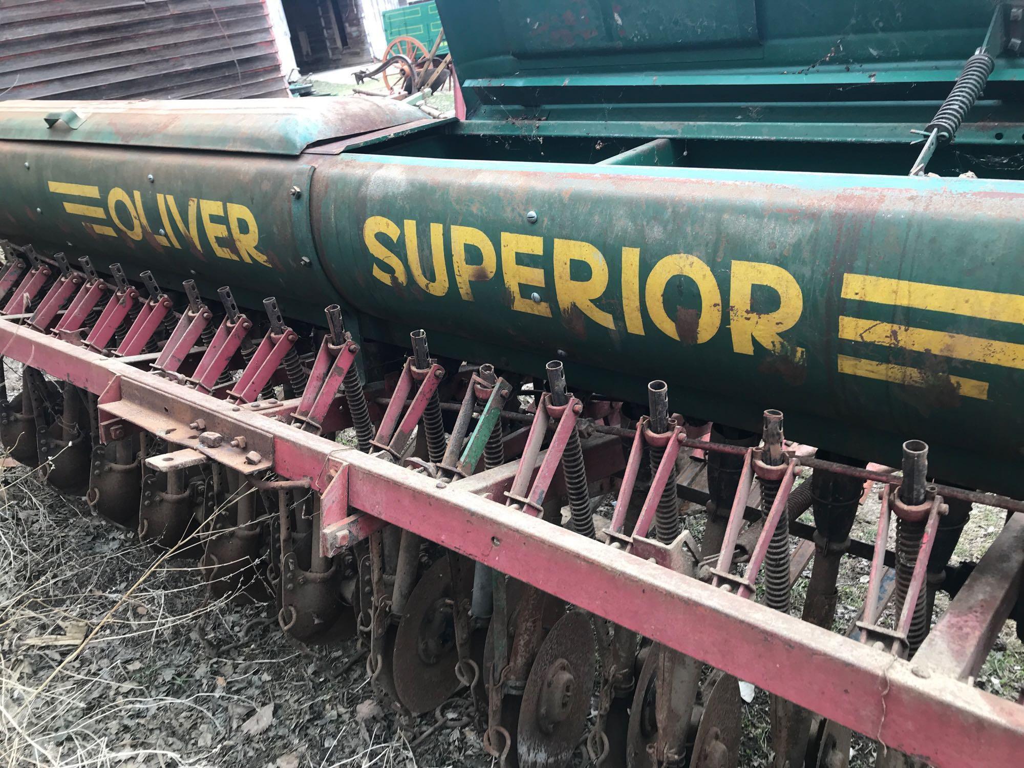 Oliver 12' grain drill with grass attachment, 6" spacing on steel wheels. Excellent condition.