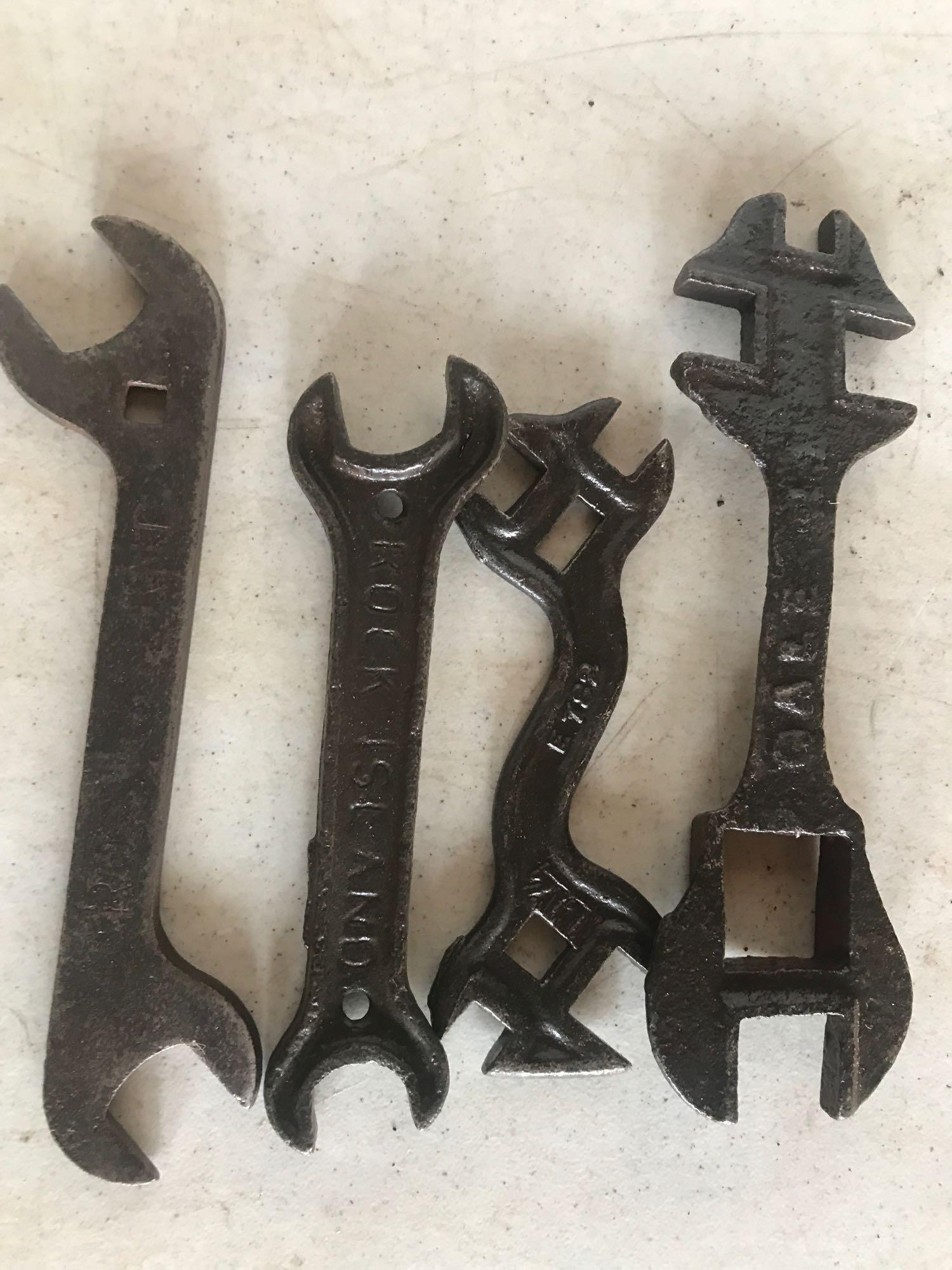 Various antique wrenches including: 2 rock island wrenches, 1 Gehl, 1 Moline plow Co., and 1 Letz