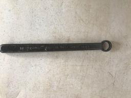 Various Antique wrenches, a grease gun and wheel wrench