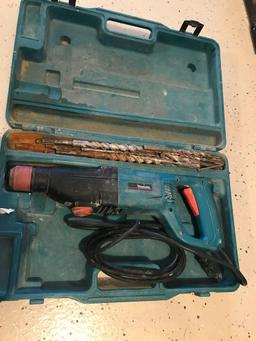 Makita model HR2420 electric cement hammer drill with case