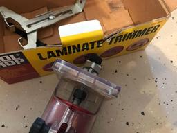 Tool shop laminate trimmer with gauges and wrenches