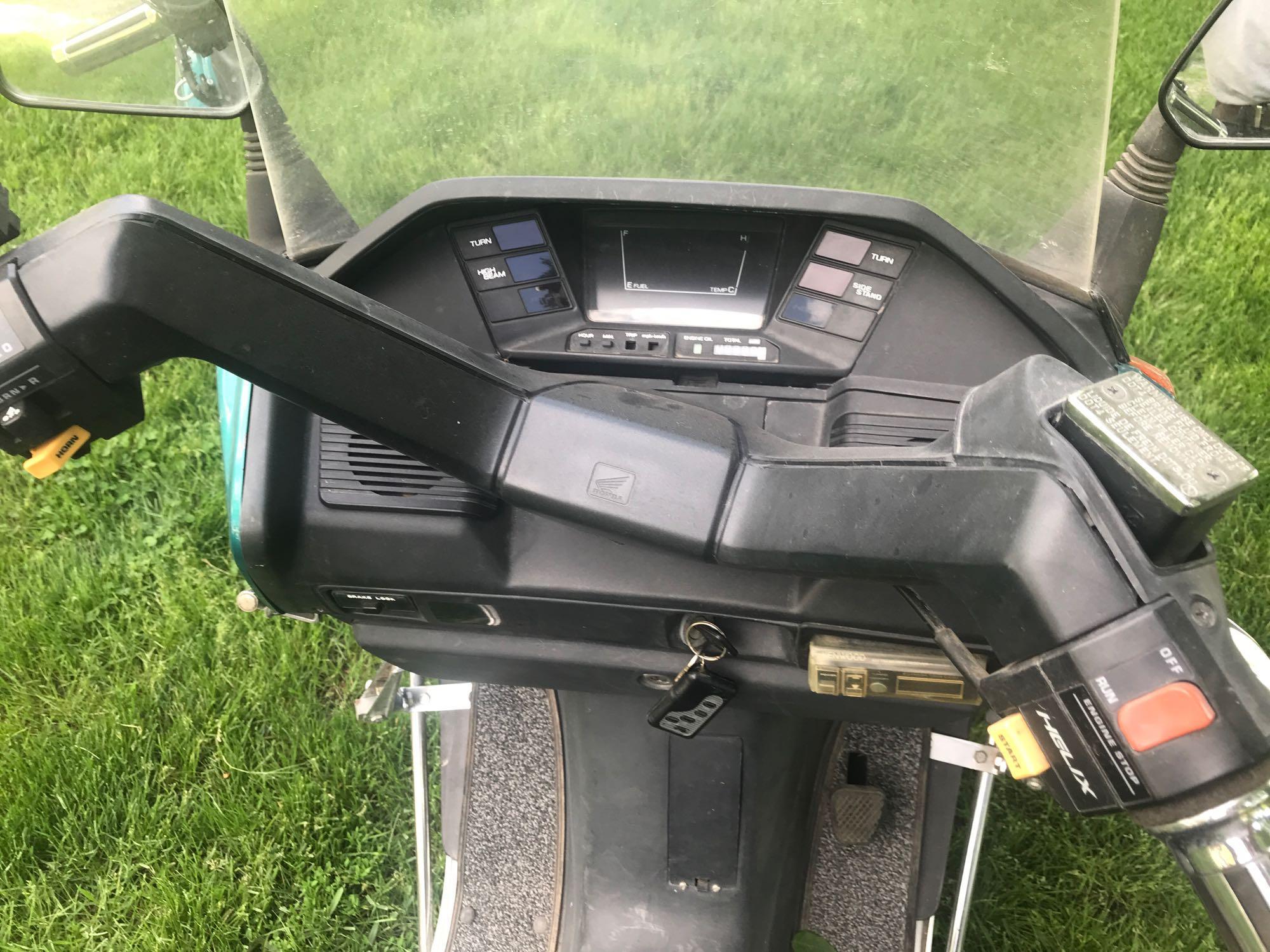 1993 Honda Helix Model CN250 Scooter w/windshield, am/fm radio, 9889 miles, serial #