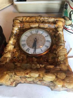 Stone framed clock, musical box, and portable sewing machine.