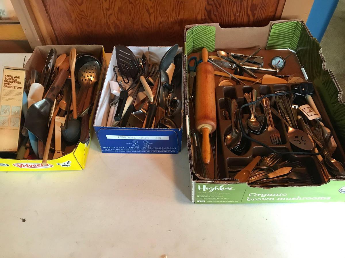 Various flatware, wood rolling pin, nut crackers, beer can opener, some advertising utensils, wooden