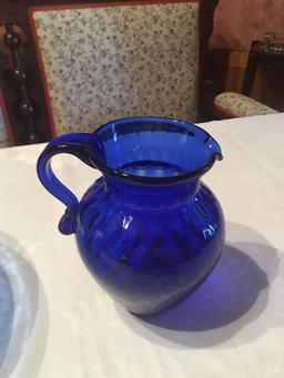 Cobalt blue 10" diameter by 4 1/2'' tall 3 footed etched bowl, 6 1/2'' and 5'' pitchers.