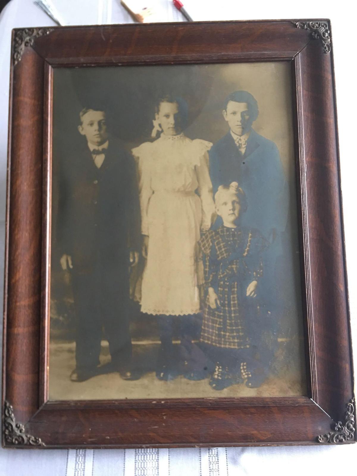 Ornate frame with a picture of children